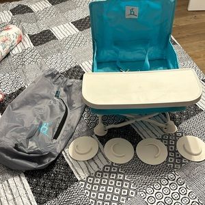 Hiccapop travel chair, folds super easy, can be used with or without tray.